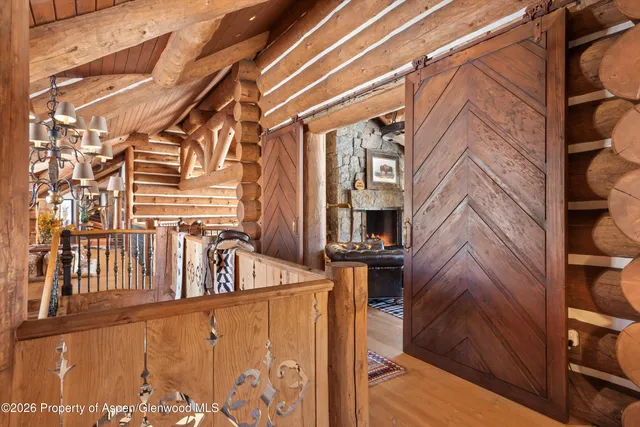 a bathroom with a granite countertop sink a toilet a mirror and shower