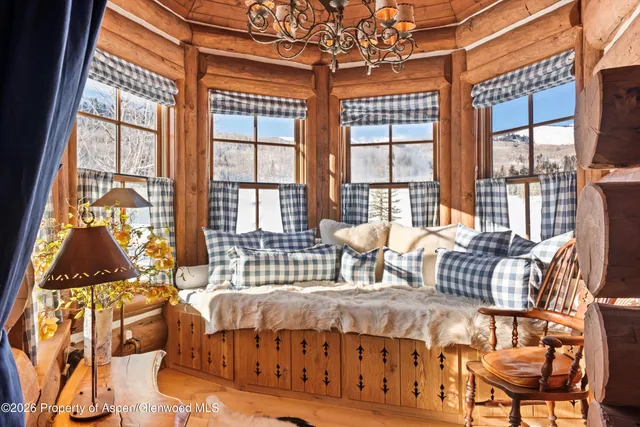 a view of a field with a building in the background