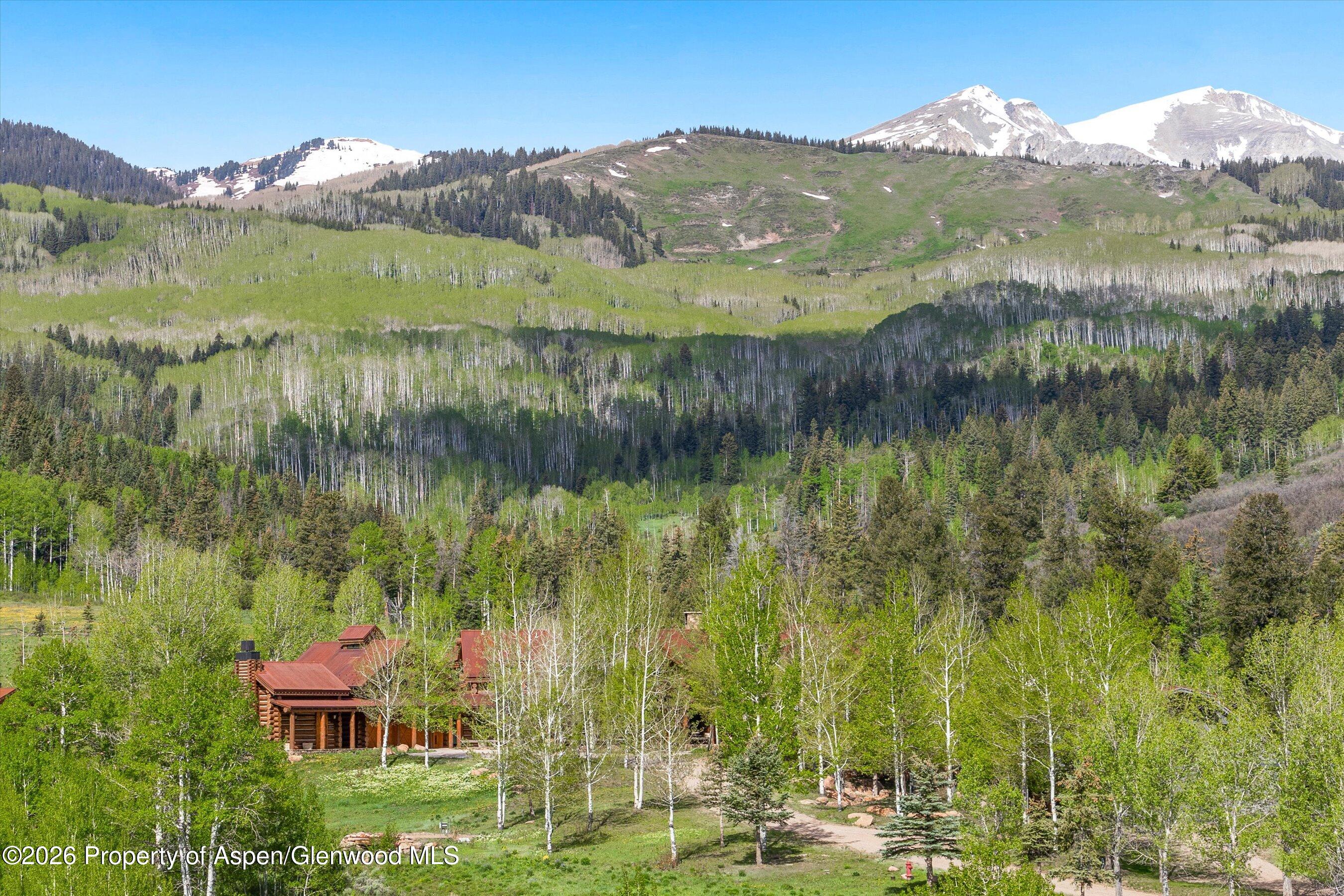 6855 Capitol Creek Road Snowmass, CO 81654 - Photo 77 of 79 a view of a lake with a mountain in the background