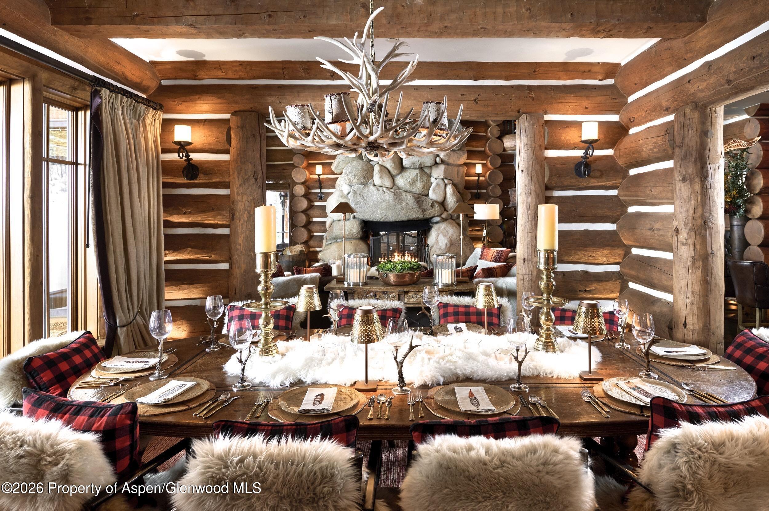 6855 Capitol Creek Road Snowmass, CO 81654 - Photo 8 of 79 a view of a dining room with furniture and chandelier