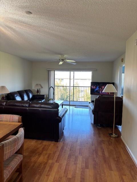 12651 Southwest 16th Court, Unit 413B Pembroke Pines, FL 33027 - Photo 11 of 66 a living room with furniture and a wooden floor