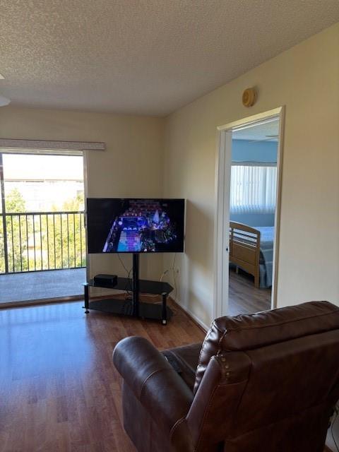 12651 Southwest 16th Court, Unit 413B Pembroke Pines, FL 33027 - Photo 13 of 66 a living room with furniture and a window