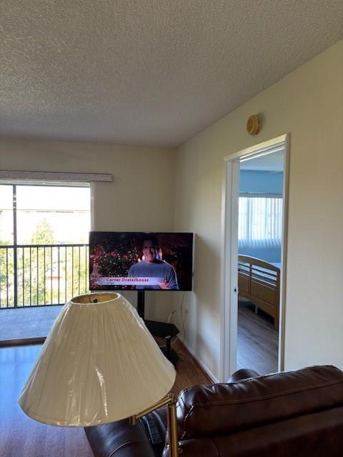 12651 Southwest 16th Court, Unit 413B Pembroke Pines, FL 33027 - Photo 14 of 66 a living room with a couch and a table