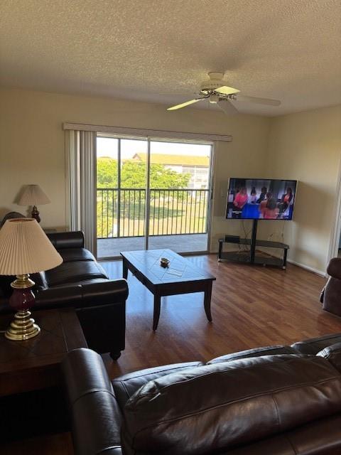 12651 Southwest 16th Court, Unit 413B Pembroke Pines, FL 33027 - Photo 16 of 66 a living room with furniture and a large window
