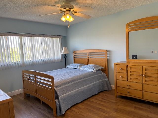 12651 Southwest 16th Court, Unit 413B Pembroke Pines, FL 33027 - Photo 17 of 66 a bedroom with a bed and a dresser