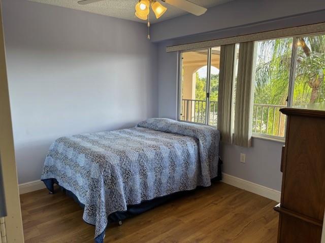 12651 Southwest 16th Court, Unit 413B Pembroke Pines, FL 33027 - Photo 26 of 66 a large bed sitting in a bedroom next to a window