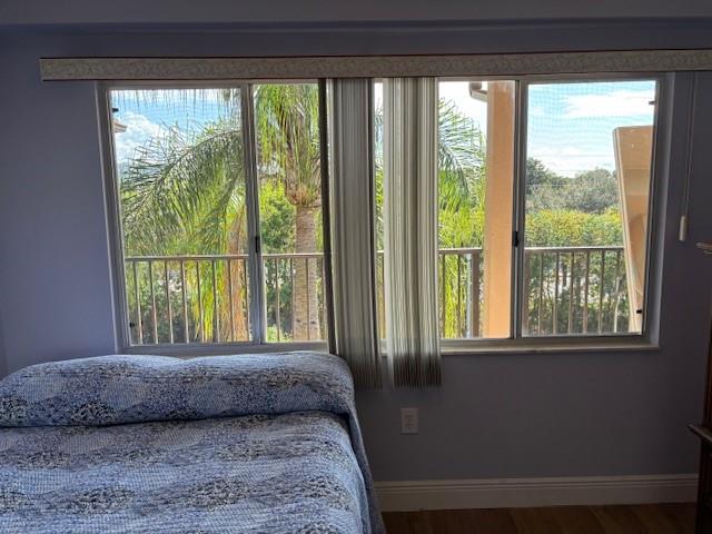 12651 Southwest 16th Court, Unit 413B Pembroke Pines, FL 33027 - Photo 28 of 66 a view of a room that has a bed and a window