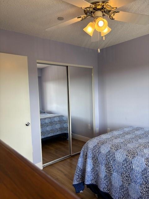 12651 Southwest 16th Court, Unit 413B Pembroke Pines, FL 33027 - Photo 29 of 66 a bedroom with a bed and a chandelier