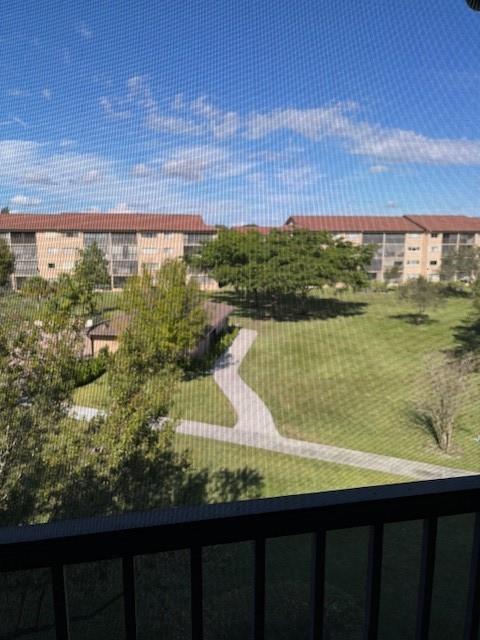 12651 Southwest 16th Court, Unit 413B Pembroke Pines, FL 33027 - Photo 3 of 66 a view of a lake from a balcony