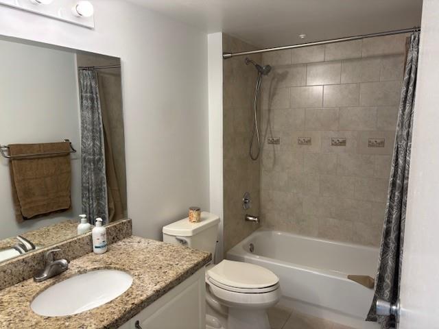 12651 Southwest 16th Court, Unit 413B Pembroke Pines, FL 33027 - Photo 31 of 66 a bathroom with a granite countertop sink toilet mirror and shower