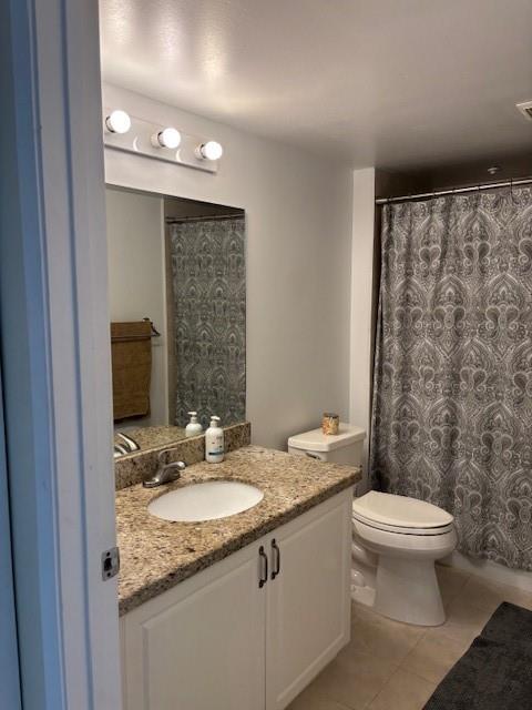 12651 Southwest 16th Court, Unit 413B Pembroke Pines, FL 33027 - Photo 32 of 66 a bathroom with a granite countertop sink toilet and shower