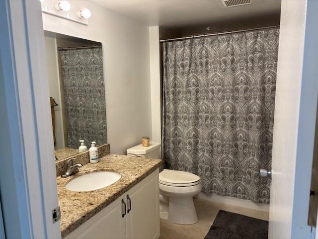 12651 Southwest 16th Court, Unit 413B Pembroke Pines, FL 33027 - Photo 33 of 66 a bathroom with a granite countertop sink a toilet and a shower