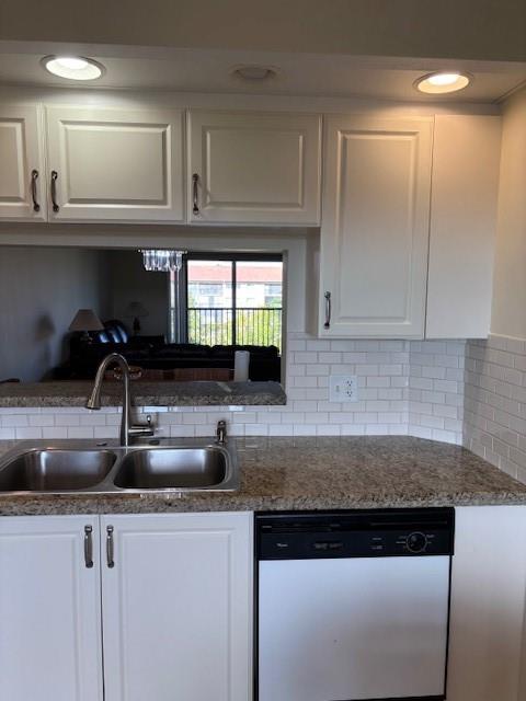 12651 Southwest 16th Court, Unit 413B Pembroke Pines, FL 33027 - Photo 43 of 66 a kitchen with granite countertop a sink and cabinets
