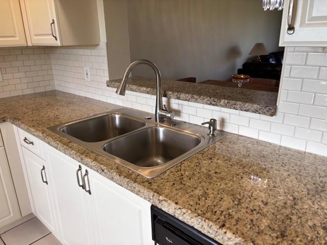 12651 Southwest 16th Court, Unit 413B Pembroke Pines, FL 33027 - Photo 46 of 66 a kitchen with granite countertop a sink and a stove