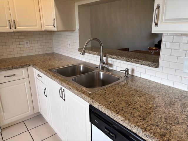 12651 Southwest 16th Court, Unit 413B Pembroke Pines, FL 33027 - Photo 47 of 66 a kitchen with granite countertop a sink and cabinets