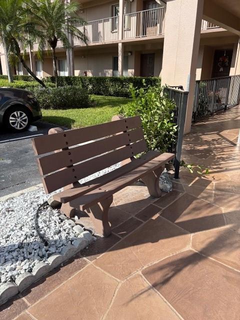 12651 Southwest 16th Court, Unit 413B Pembroke Pines, FL 33027 - Photo 59 of 66 a view of a bench in front of building