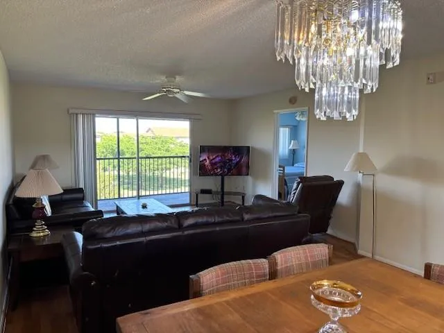 a room with furniture and chandelier