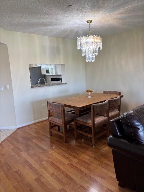 12651 Southwest 16th Court, Unit 413B Pembroke Pines, FL 33027 - Photo 10 of 66 a room with a table chairs and a window