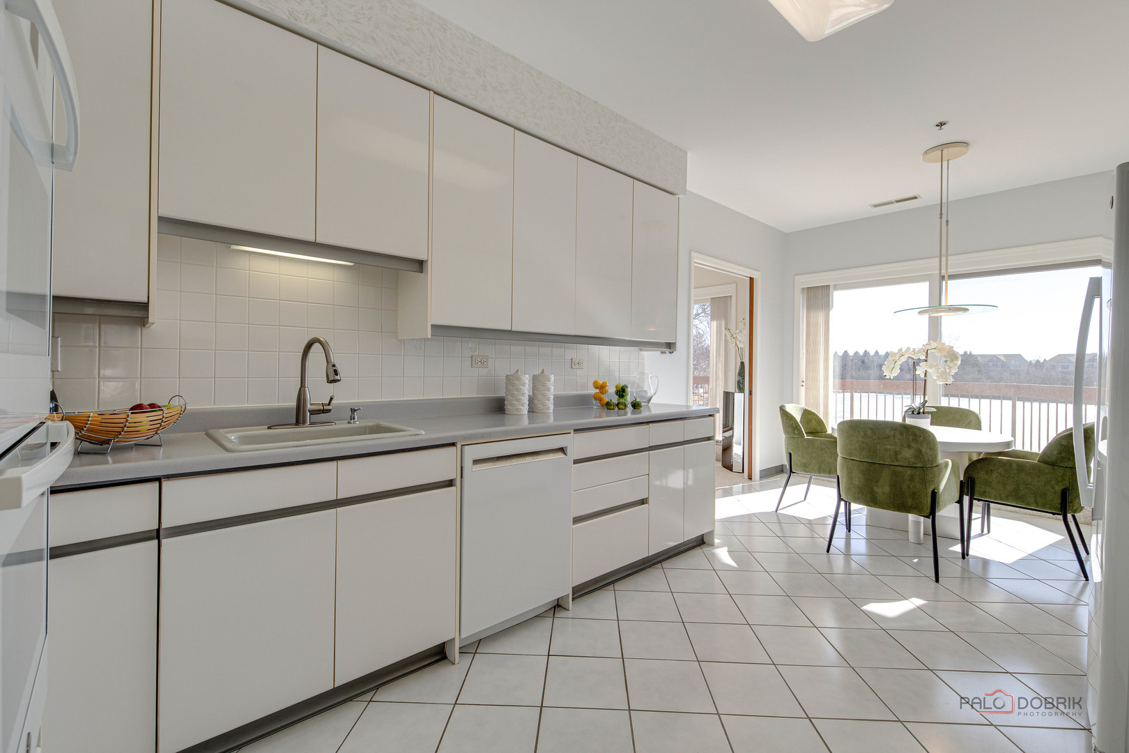 209 Rivershire Lane, Unit 203 Lincolnshire, IL 60069 - Photo 20 of 50 a kitchen with cabinets and sink