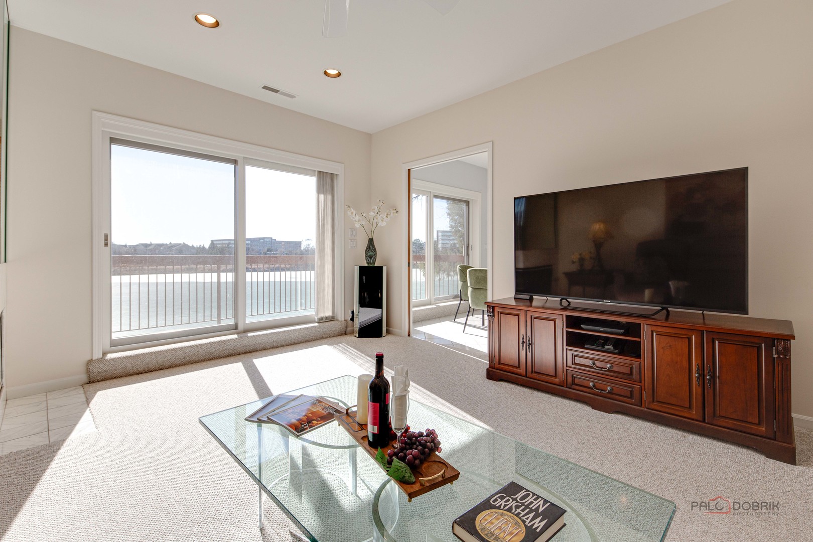 209 Rivershire Lane, Unit 203 Lincolnshire, IL 60069 - Photo 25 of 50 a living room with furniture and a flat screen tv