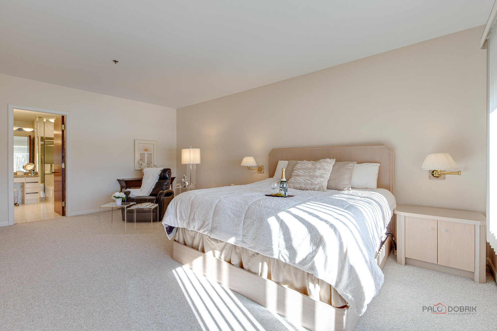 209 Rivershire Lane, Unit 203 Lincolnshire, IL 60069 - Photo 27 of 50 a bedroom with a bed and a chair