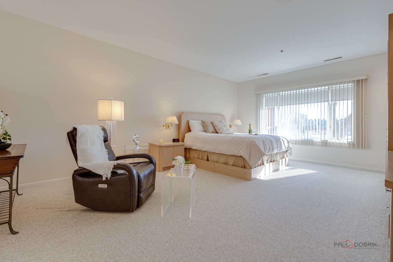 209 Rivershire Lane, Unit 203 Lincolnshire, IL 60069 - Photo 33 of 50 a spacious bedroom with a bed and window