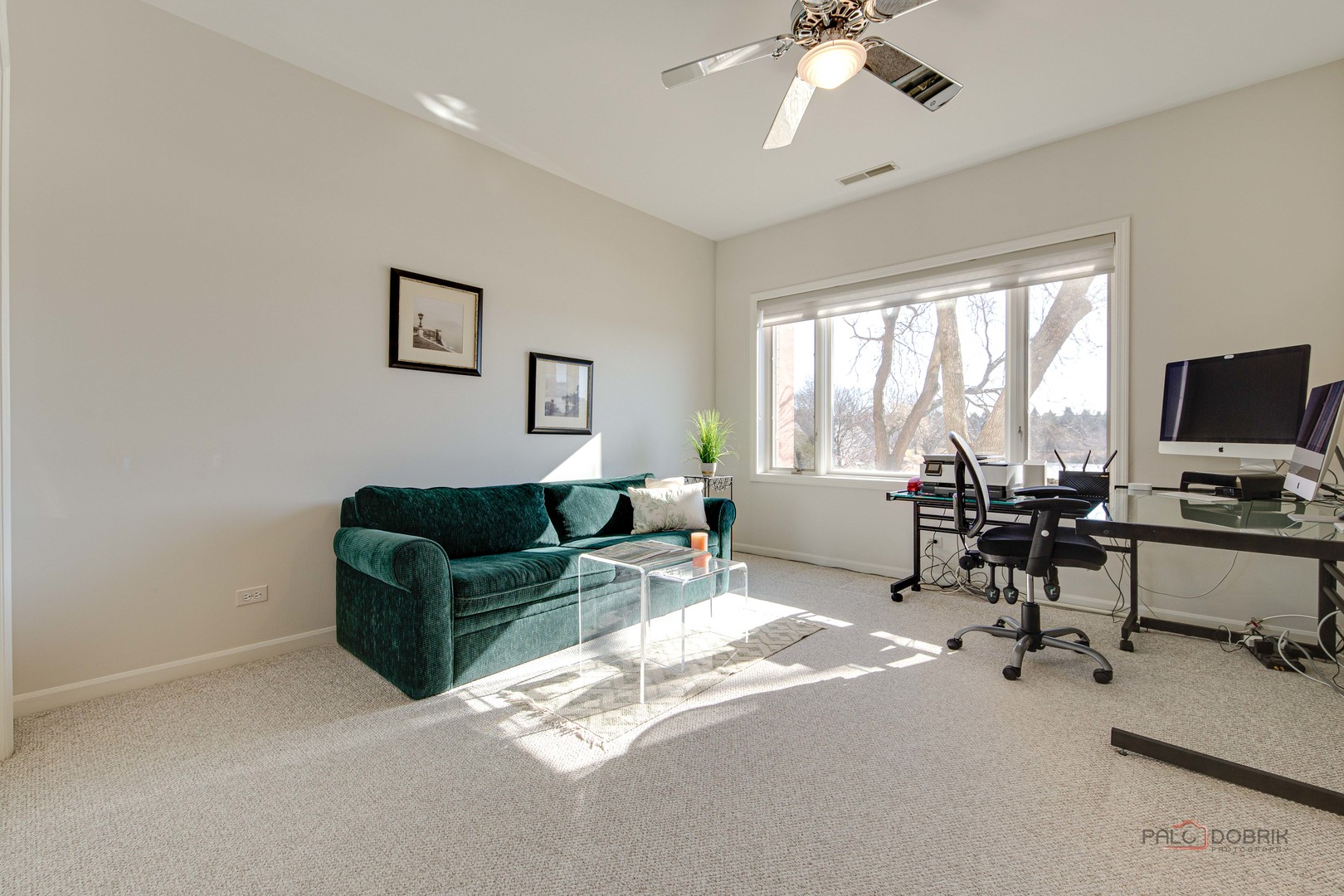 209 Rivershire Lane, Unit 203 Lincolnshire, IL 60069 - Photo 34 of 50 a living room with furniture and a flat screen tv