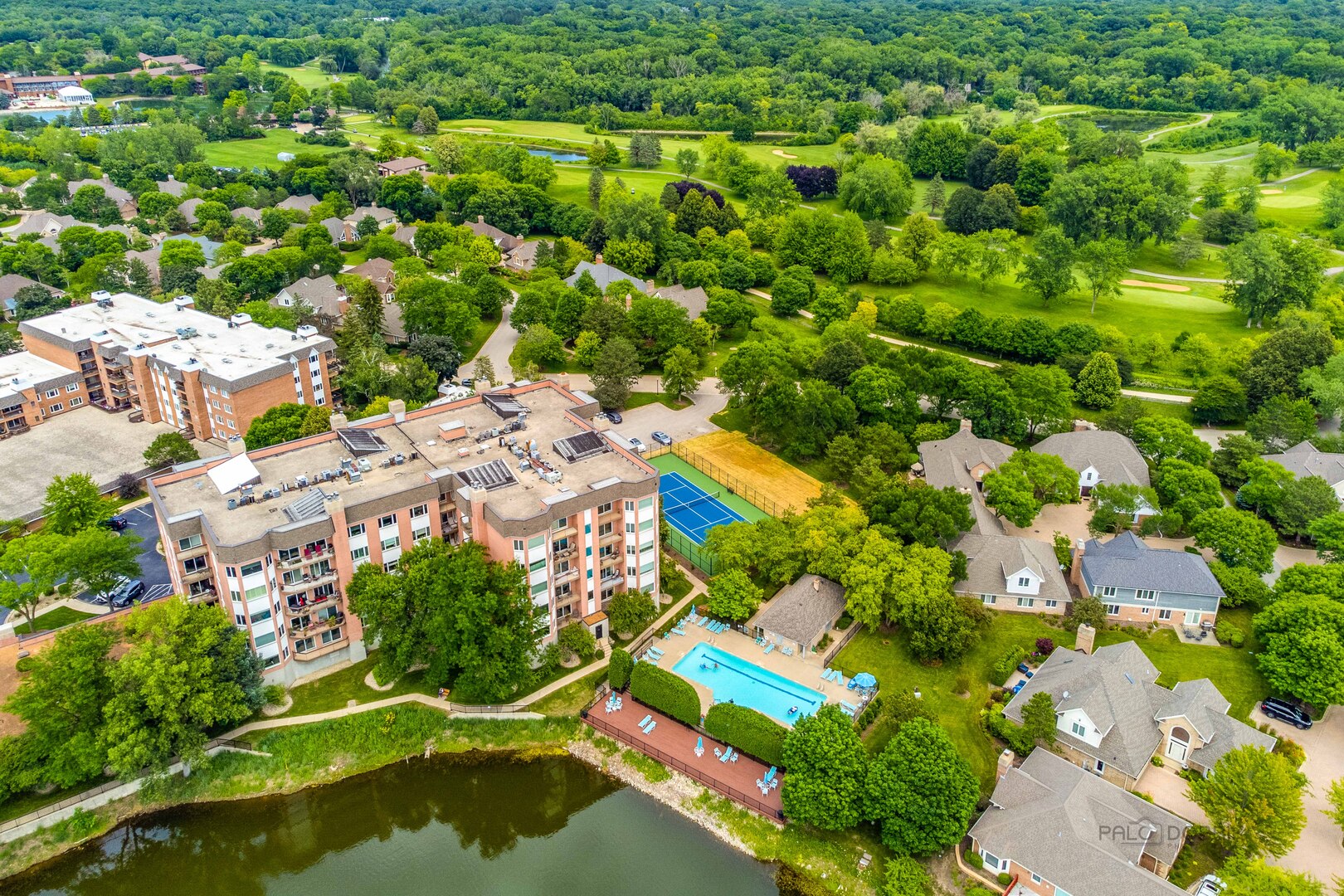 209 Rivershire Lane, Unit 203 Lincolnshire, IL 60069 - Photo 45 of 50 an aerial view of residential houses with outdoor space and trees