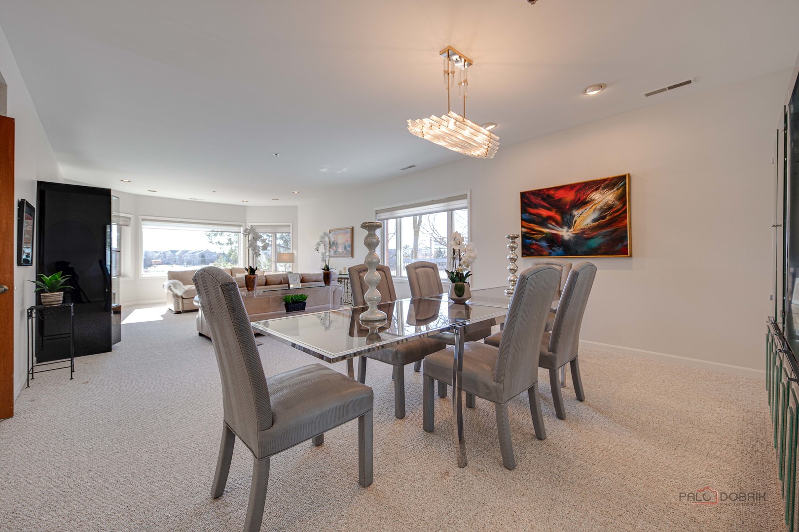 209 Rivershire Lane, Unit 203 Lincolnshire, IL 60069 - Photo 6 of 50 a view of a dining room with furniture and chandelier