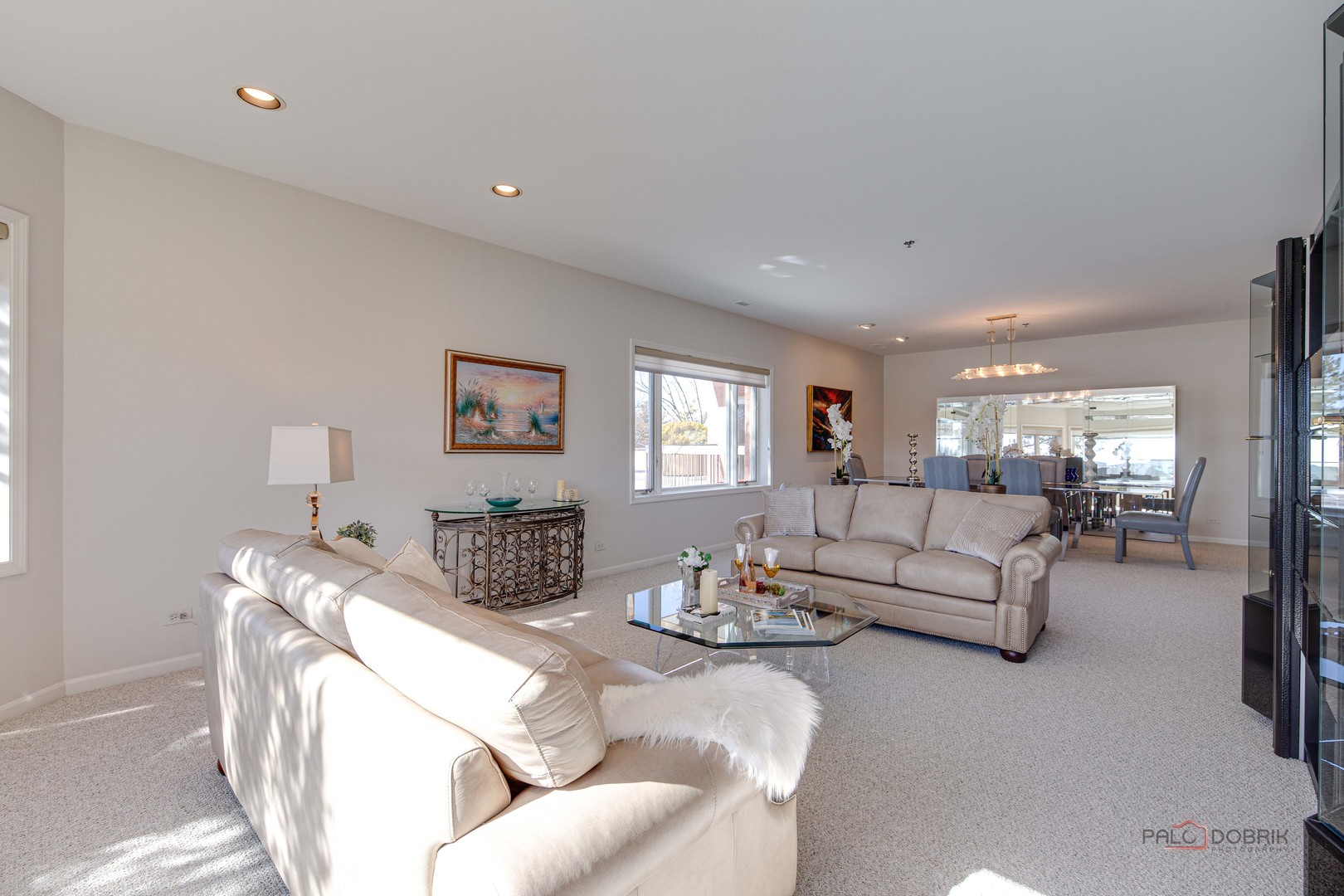 209 Rivershire Lane, Unit 203 Lincolnshire, IL 60069 - Photo 7 of 50 a living room with furniture and a table