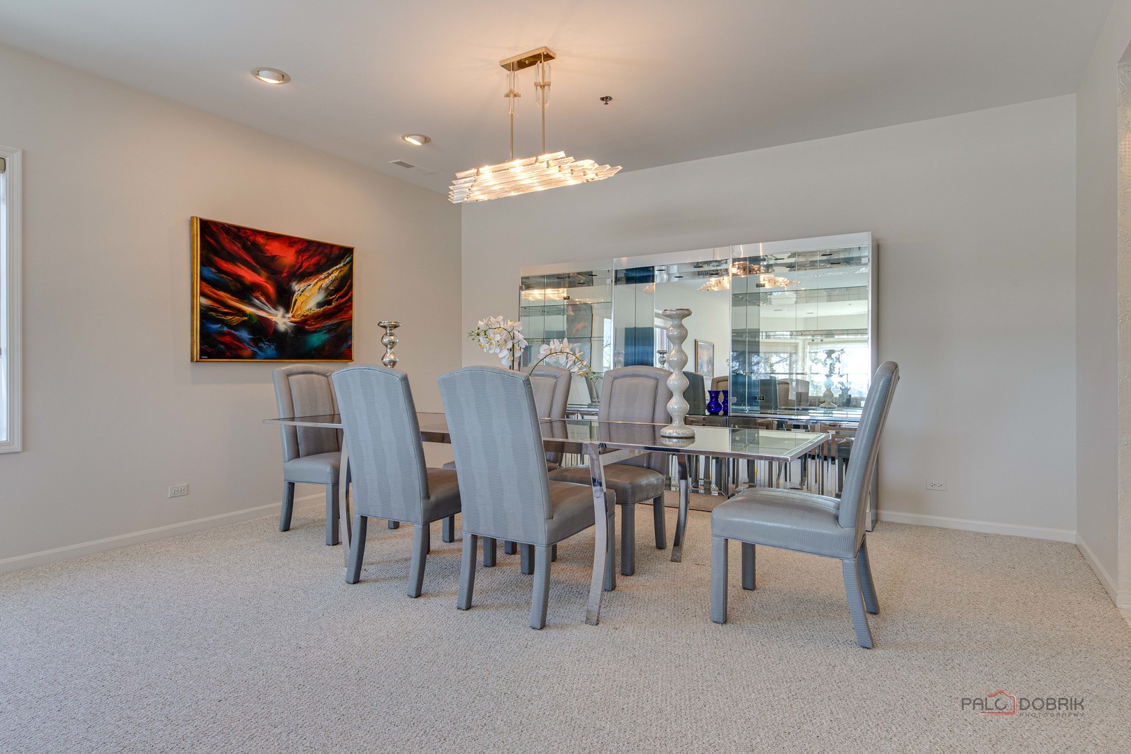 209 Rivershire Lane, Unit 203 Lincolnshire, IL 60069 - Photo 8 of 50 a view of a dining room with furniture and chandelier