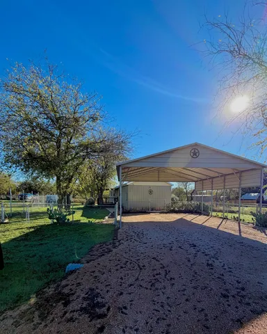 a view of a big house with a big yard