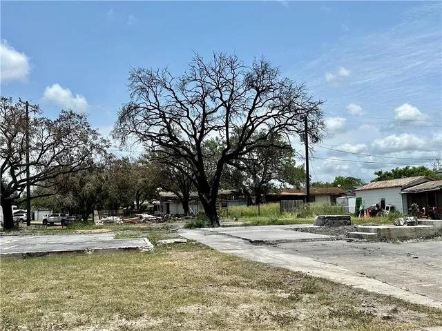 a view of swimming pool and trees in the background
