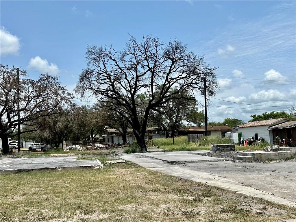 821 Hamilton Street Sinton, TX 78387 - Photo 3 of 4 a view of swimming pool and trees in the background