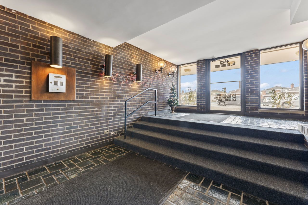 4623 North Chester Avenue, Unit 206 Chicago, IL 60656 - Photo 13 of 19 a view of backyard with a chair and a barbeque