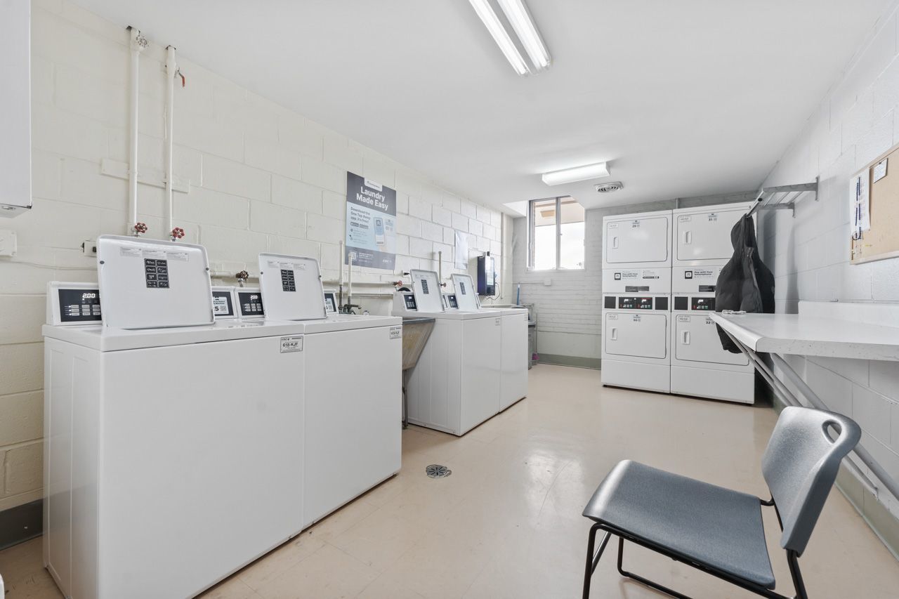 4623 North Chester Avenue, Unit 206 Chicago, IL 60656 - Photo 14 of 19 a utility room with cabinets dryer and washer