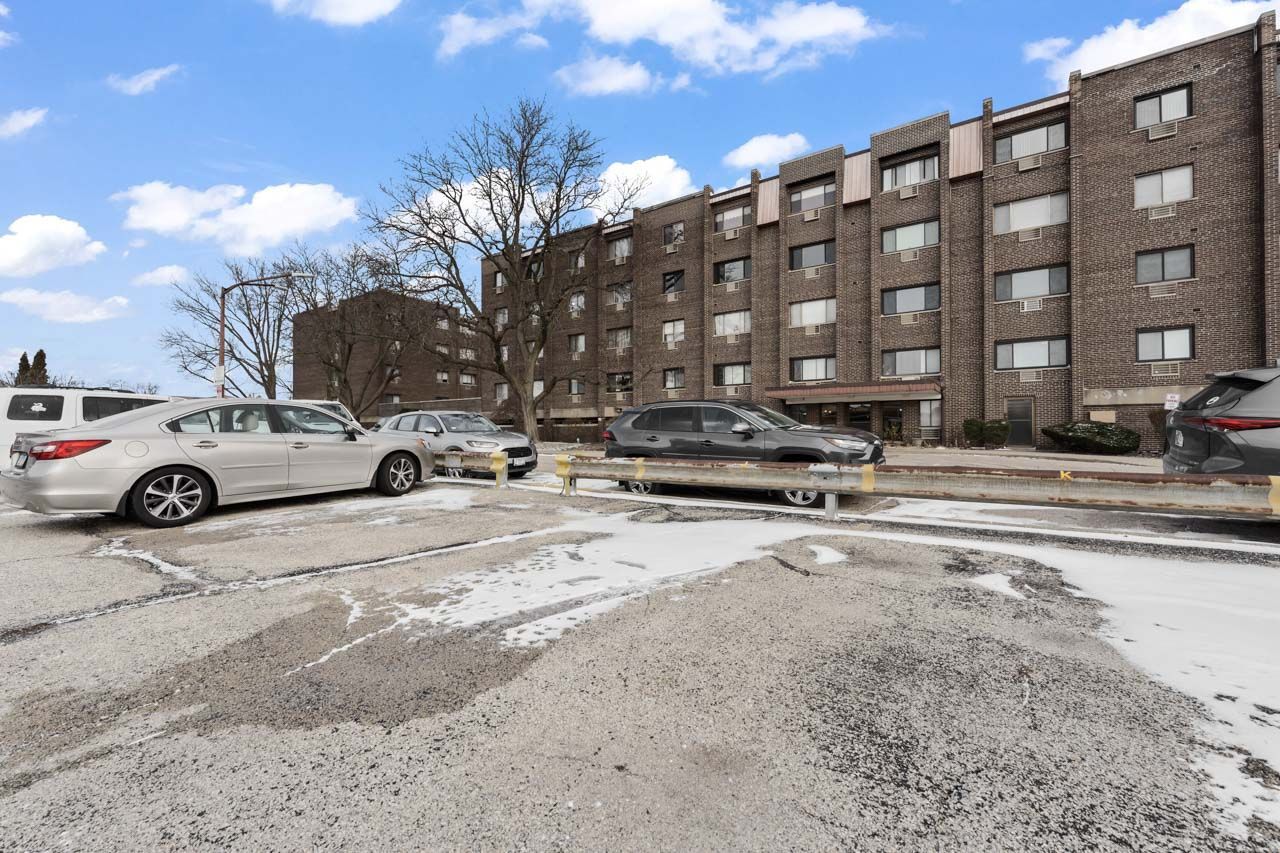 4623 North Chester Avenue, Unit 206 Chicago, IL 60656 - Photo 16 of 19 a view of a cars parked in front of a building