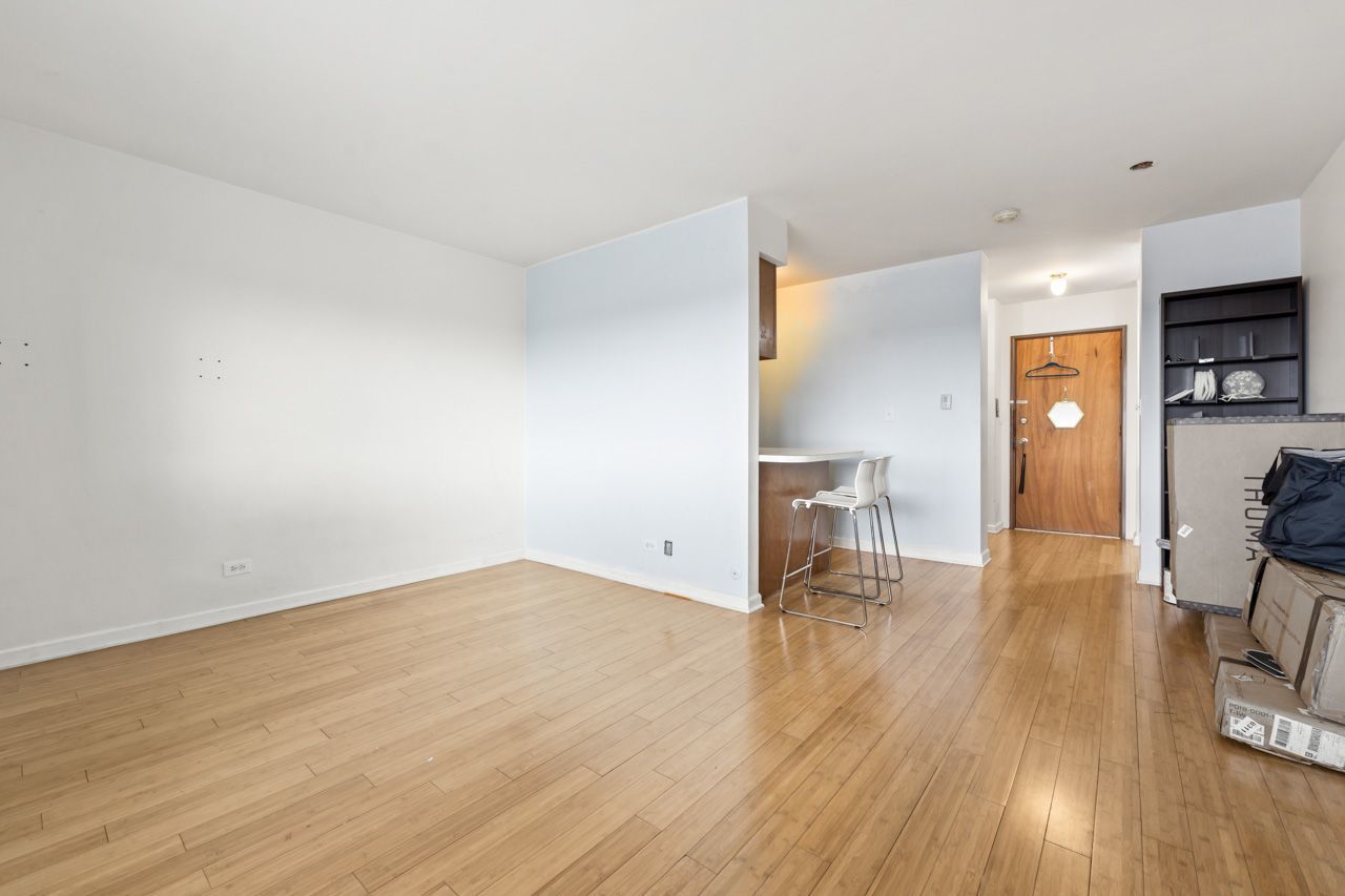 4623 North Chester Avenue, Unit 206 Chicago, IL 60656 - Photo 8 of 19 a view of empty room with wooden floor