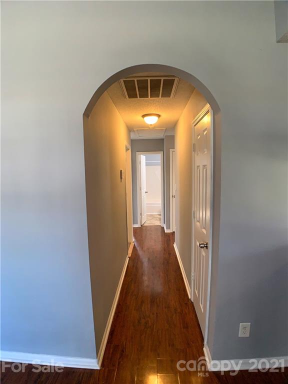 1524 Capps Hill Mine Road Charlotte, NC 28216 - Photo 17 of 32 a view of a hallway with wooden floor