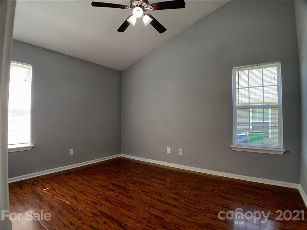 1524 Capps Hill Mine Road Charlotte, NC 28216 - Photo 20 of 32 wooden floor in an empty room with a window