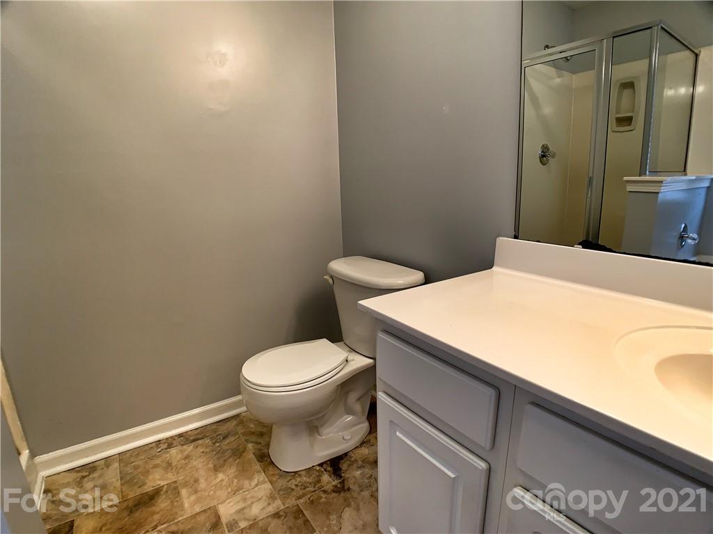 1524 Capps Hill Mine Road Charlotte, NC 28216 - Photo 23 of 32 a bathroom with a toilet and a sink