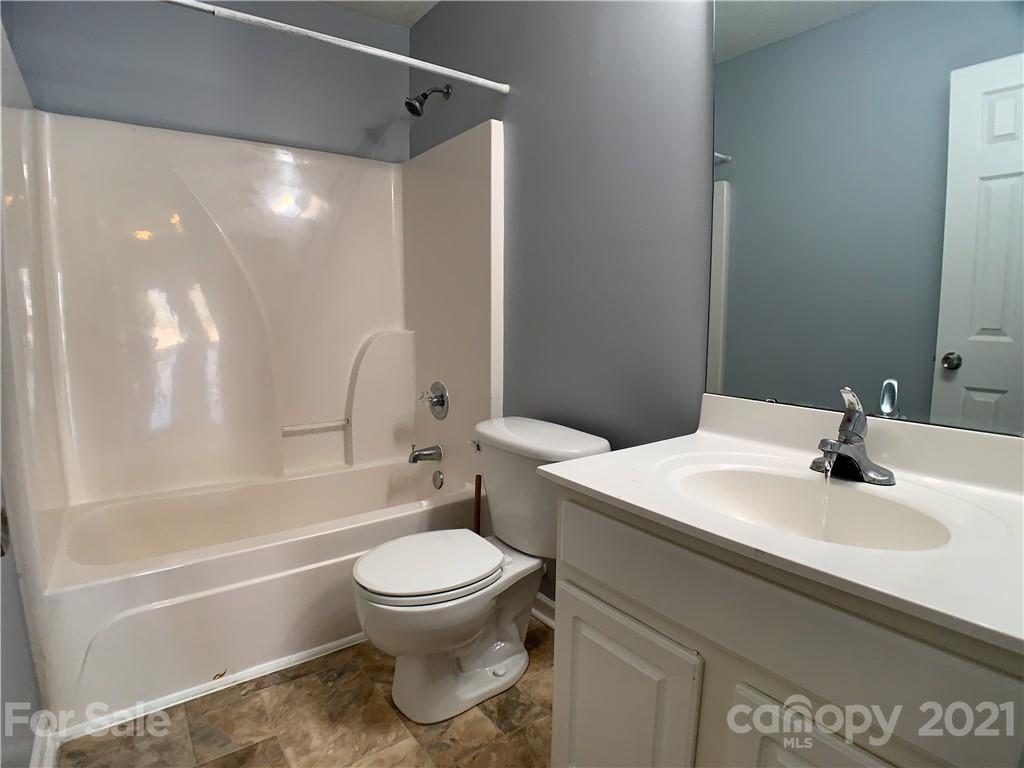 1524 Capps Hill Mine Road Charlotte, NC 28216 - Photo 27 of 32 a bathroom with a sink toilet and shower