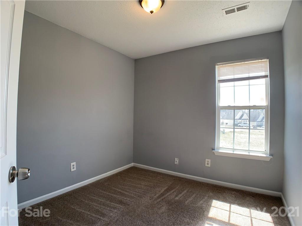 1524 Capps Hill Mine Road Charlotte, NC 28216 - Photo 29 of 32 a view of an empty room with a window