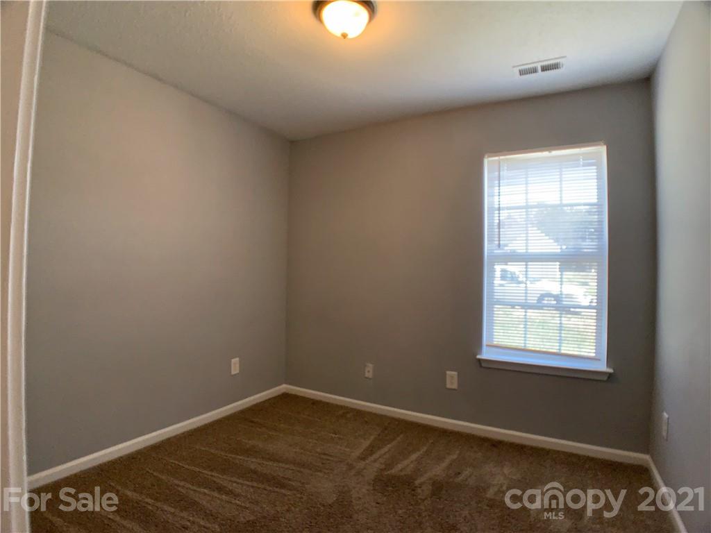 1524 Capps Hill Mine Road Charlotte, NC 28216 - Photo 31 of 32 an empty room with a window