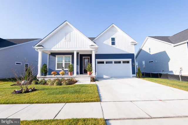 a front view of a house with a yard outdoor seating and yard