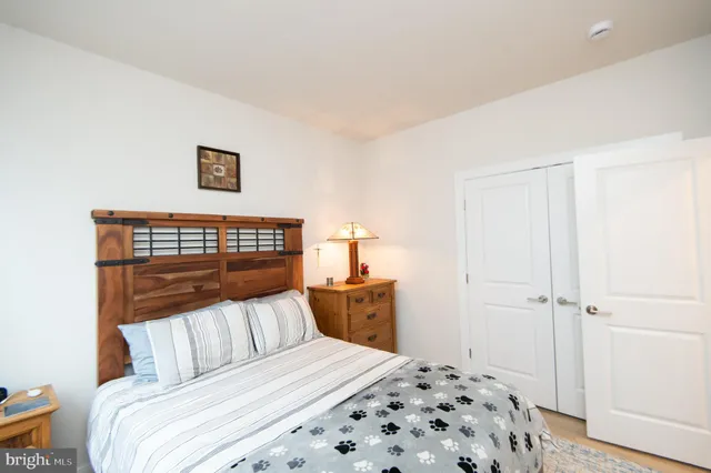 a bedroom with a bed and a table