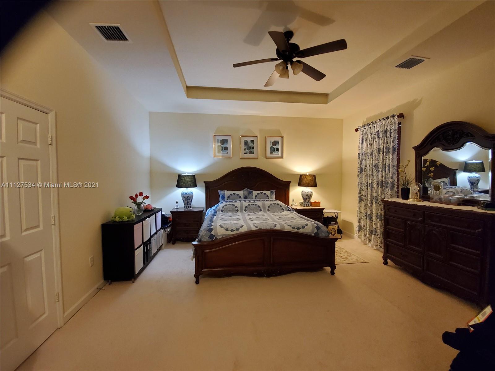 24075 Southwest 113 Passage Homestead, FL 33032 - Photo 11 of 35 a living room with furniture and a ceiling fan