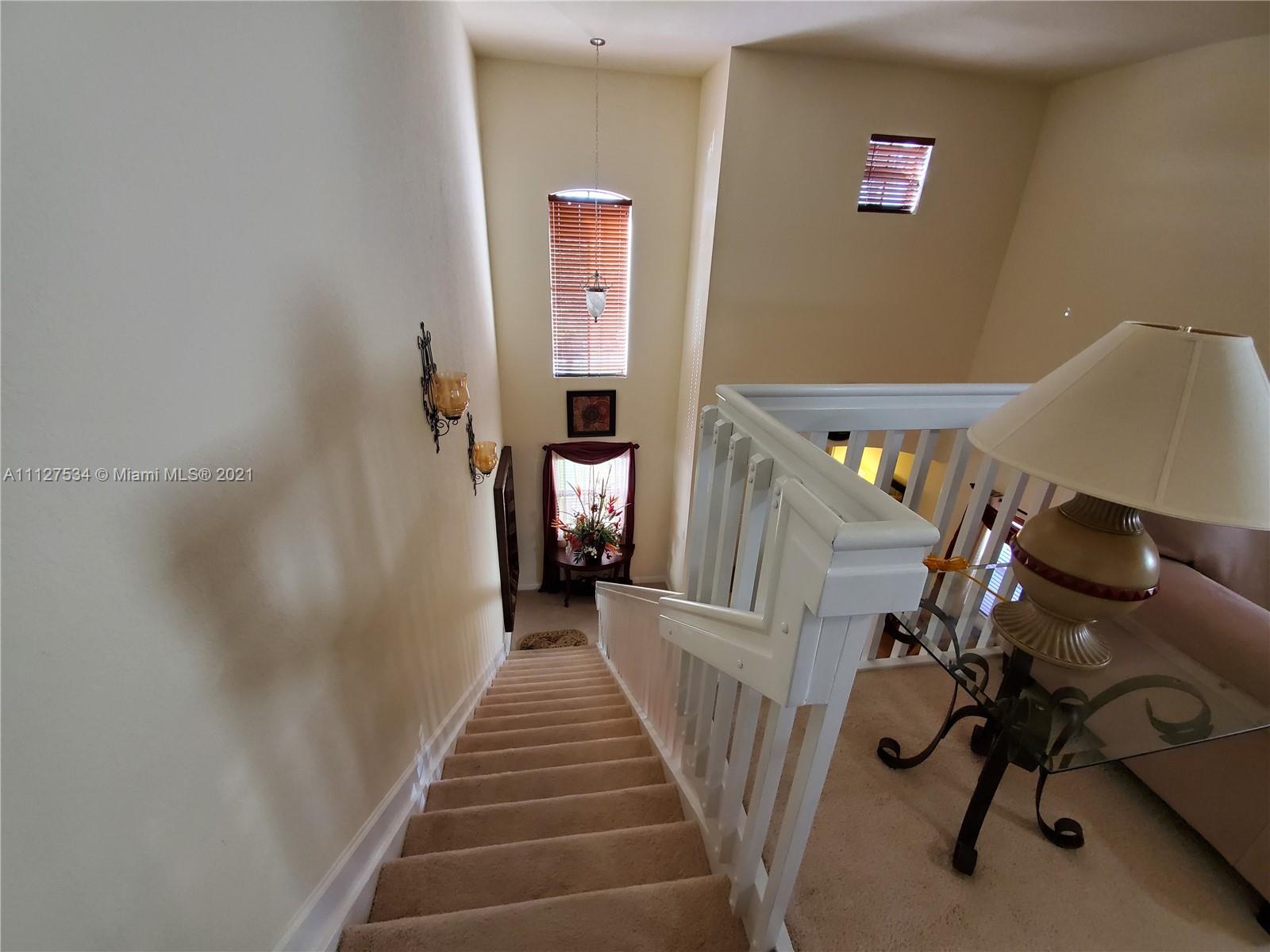 24075 Southwest 113 Passage Homestead, FL 33032 - Photo 20 of 35 a view of a hallway with staircase