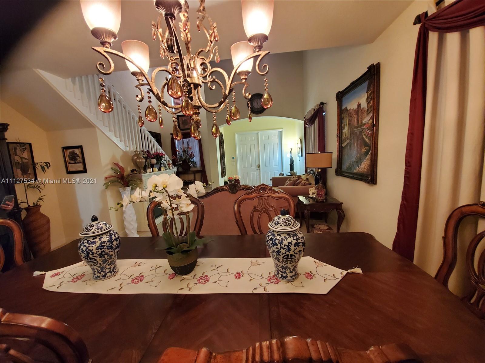 24075 Southwest 113 Passage Homestead, FL 33032 - Photo 5 of 35 a view of a dining room with furniture