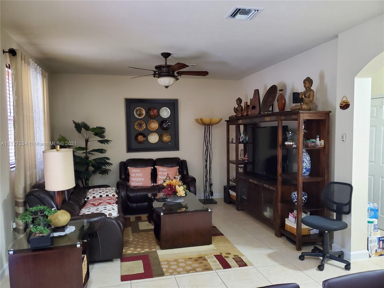 24075 Southwest 113 Passage Homestead, FL 33032 - Photo 6 of 35 a living room with furniture